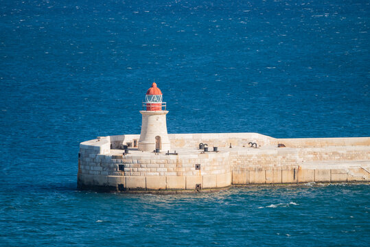 A lighthouse in the sea on the island of Malta, Valletta.