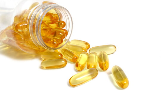 On a white background there is a transparent jar with vitamin D.