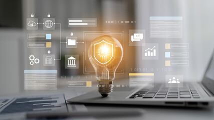 A creative representation of data security featuring a light bulb over a laptop, showcasing modern technology and innovative solutions for business challenges. Gantry