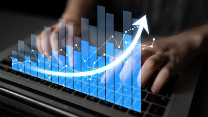 Engaging visual of hands on a laptop with a rising graphic chart, highlighting the importance of data analysis and financial growth in today digital business landscape. Scalp