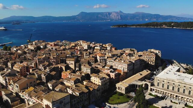 Kerkyra city, Corfu island, Greece, beautiful summer aerial drone view of Kerkyra old town center, with Ionian sea harbour port, Saint Spyridon Church, the Royal Palace and The Old Fortress 