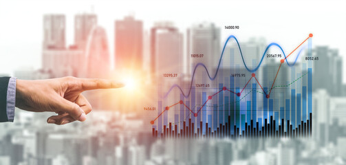 Business professional points at a financial growth graph, illustrating dynamic trends in investment performance against an urban cityscape background. Scalp