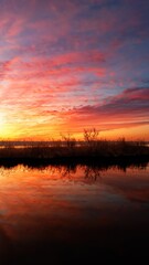 Naklejka premium Colorful sunset with dramatic clouds