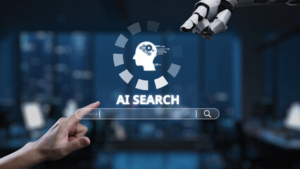 This image depicts a human hand interacting with a robotic arm in a modern office setting, symbolizing the interplay between artificial intelligence and human creativity. Synapse