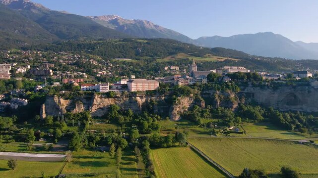 Aerial view of Embrun and its famous cliff-top plateau. Summer in Hautes-Alpes, French Alps, France