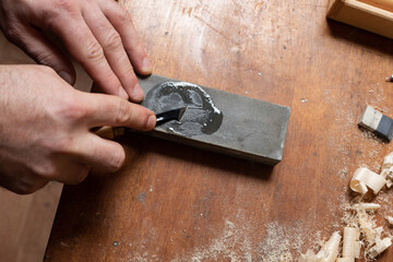 The master sharpens the cutting tool