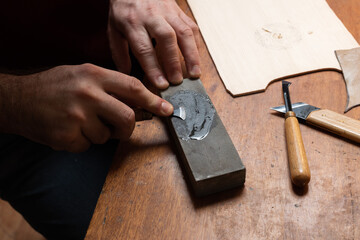 The master sharpens the cutting tool