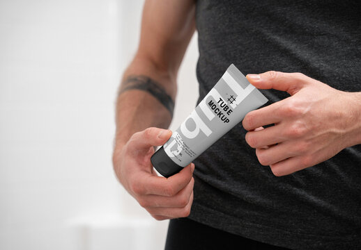 Men Holding Cosmetic Tube Mockup
