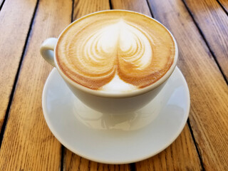 Cappuccino Coffee Cup on Rustic Table