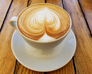 Cappuccino Coffee Cup on Wooden Table