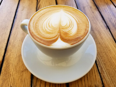 Cappuccino Coffee Cup on Rustic Table