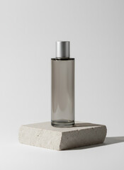 Minimalist Perfume Bottle On Stone Pedestal With Silver Cap In Studio Still Life