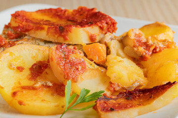 Traditional Greek moussaka slice with minced meat and potato layers.