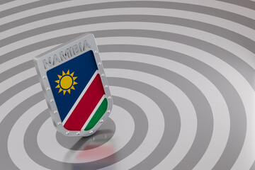 Naklejka premium Namibia national flag on metallic shield security concept