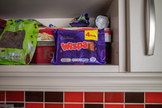 Norwich, Norfolk, UK - January 18 2026. Illustrative editorial photo of a multi pack of 4 Cadbury Wispa chocolate bars in a kitchen cupboard