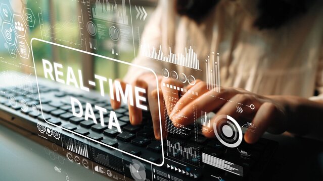 Hands Typing on Keyboard with Digital Overlays of Real-Time Data Visualization Concepts and Analytics. Asymptotic smart data analytic. - Powered by Adobe