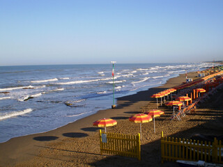 Beach and sea view at Lido dei Pini in Anzio, Italy, featuring sandy shoreline, clear blue water, and Mediterranean coastal scenery. Popular seaside destination along the Tyrrhenian Sea, known for its