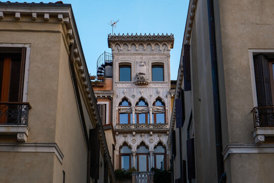 Gothic Architecture of Palazzo Contarini del Bovolo in Venice, Italy, Detailed View of Historic Venetian Facade and Famous Spiral Staircase Tower under Blue Sky