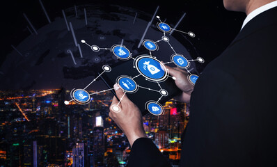 A business professional engaged with digital icons, illustrating the fusion of technology and networking over a vibrant city skyline at night, showcasing innovation. Tessel