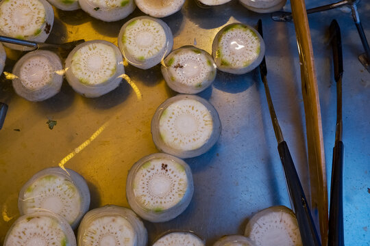 Fresh Artichoke Bottoms Soaking in Water at a Venetian Market, Traditional Italian Fondi di Carciofo Preparation, Healthy Organic Gourmet Food Ingredients, Venice