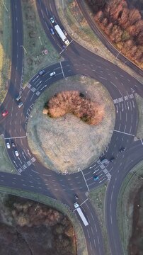 Drone View of Vehicles Moving Through Roundabout in Basingstoke, England. UK. Vertical