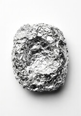 Top view of crumpled shiny aluminum foil for kitchen cooking