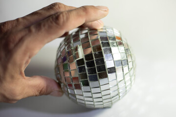 Mirror ball. A ball of small mirrors.