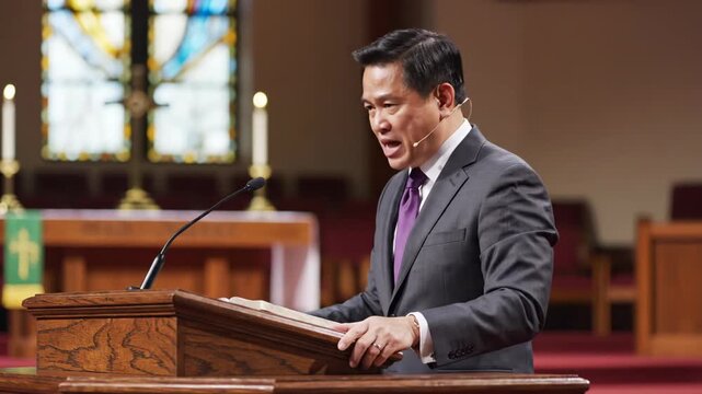 Sequence of an asian adult male pastor giving an emotional sermon from a church pulpit. Christian minister preaching about faith and spirituality during a sunday worship service