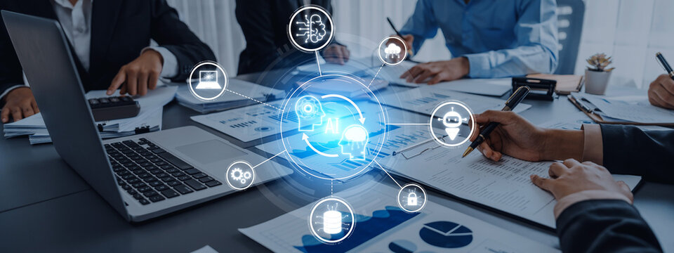 Team members collaborate in a modern office setting, utilizing advanced technology and data analysis, highlighting the role of artificial intelligence in business strategies. Trope