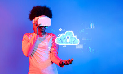 A young individual explores a vibrant world using a virtual reality headset, interacting with a digital cloud computing graphic, showcasing modern technology and connectivity. XDMCP