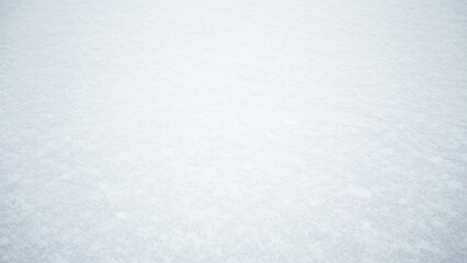 Fototapeta premium A close-up view of pristine white snow with a subtle texture and gentle gradient of light