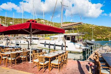 Restaurant tables in beautiful sailing port of Sivota, Lefkada island, Greece