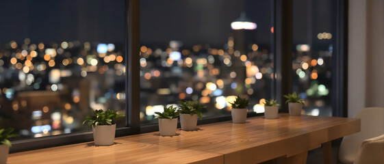 Obraz premium Potted plants on a wooden table at night overlook a glowing urban skyline through a large window, creating a cozy modern interior mockup ideal for architecture and design presentation