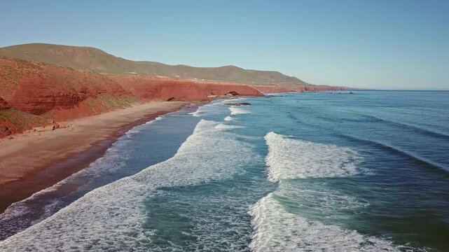 Aerial view on Legzira beach with arched rocks on the Atlantic coast in Morocco, 4k