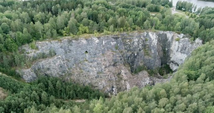 Aerial view of old T&ouml;rm&auml; open pit mine in cloudy summer weather, Lohja, Finland.