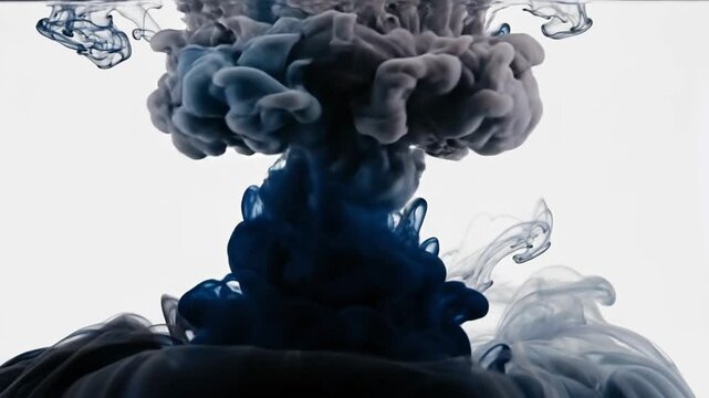 Abstract ink explosion in water, creating a mesmerizing and dynamic visual effect against a white background.