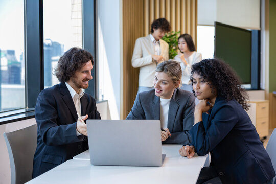 Team of diversity business people are discussing over the new strategic strategy project on investment real estate while working in modern office building for new project and planning