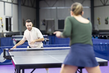 People playing table tennis match enjoying sport activity