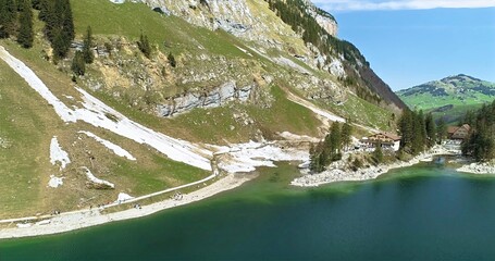 Peaceful Lake With Mountain Trails, Tranquil Alpine Landscape With Shimmering Waters And Rugged Slopes