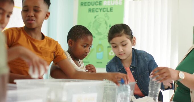 Children and teacher pointing and guiding sorting plastic bottles into bins at school for recycling