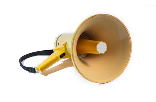 Yellow megaphone or bullhorn isolated on a white background. A portable loudspeaker with a black strap used for announcements, protests, and directing crowds