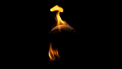 A flaming baseball suspended in darkness, creating a striking visual contrast.