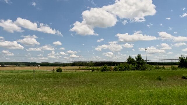 Driving Through the 45th Parallel, Halfway Between the North Pole and the Equator. A POV shot from a vehicle driving past a roadside sign marking the 45th Parallel North in Michigan.