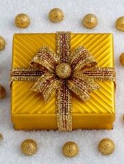 Luxurious golden present wrapped with a sparkling bow rests on white snow, surrounded by shimmering ornaments, conveying festive glamour perfect for holiday promotions or cards.