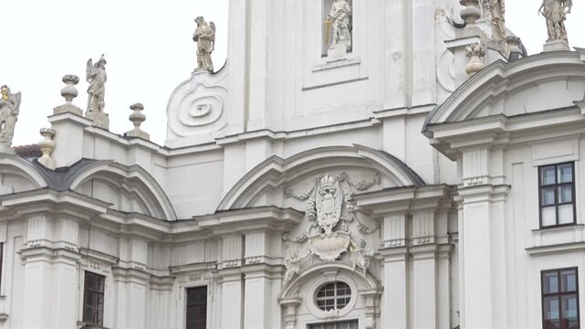 Baroque architectural details of ornate statues and classical facade in Vienna Austria 