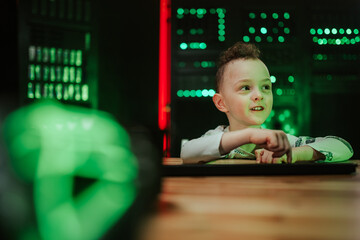 Little boy interacting with future technology in data center