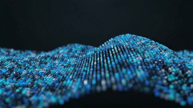 Close-up view of a wavy pattern made of numerous small blue and black beads on a black background with a shallow depth of field.