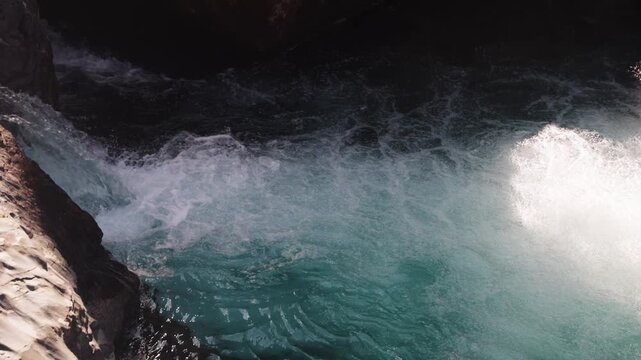 Close Up Static Shot of Churning White Water Bubbles and Turquoise Current, Abstract Nature Background, Powerful River Current