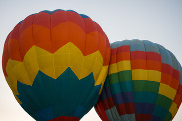 colorful hot air balloons glowing against sky