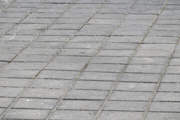 Abstract background. New cobblestone pavement close up view. Pavement. textured bricks seamless pattern. pathway texture. Outdoor concrete slab sidewalk. background, backgrounds. city